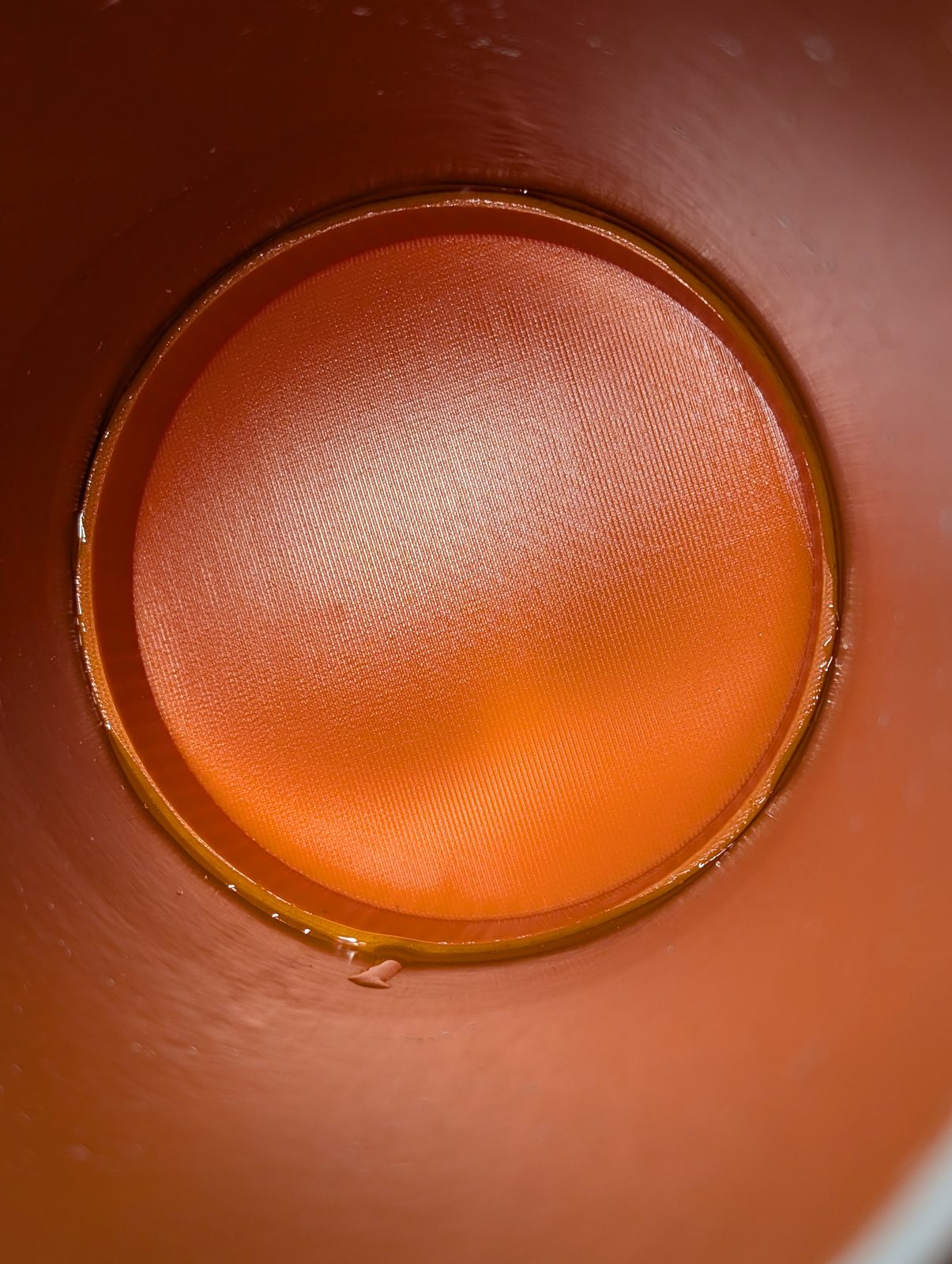Looking down into a joint that has, so far, never once leaked. I check anyway. Looking down the pipe at the printed floor, glued in and sealed